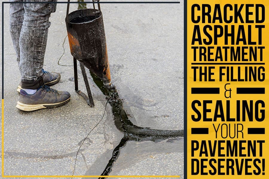 A professional treating cracked asphalt by filling and sealing it.