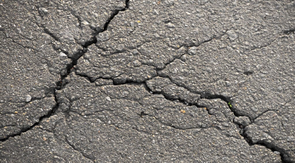 Cracked parking lot in need of repair