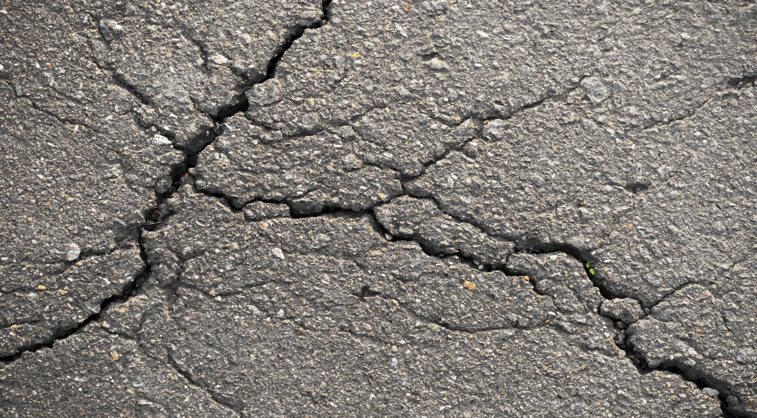 Cracked parking lot in need of repair